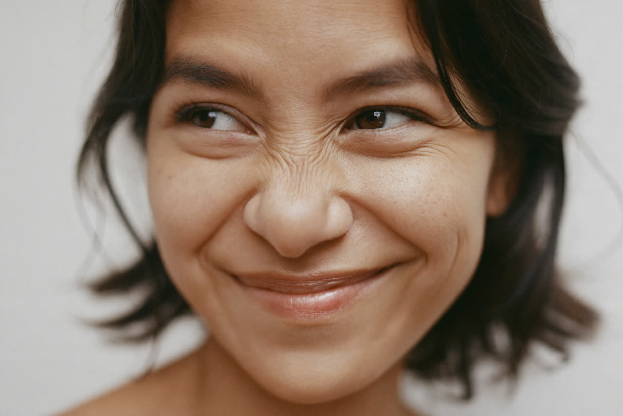The beginning of a smile, in the Quiet Smile style